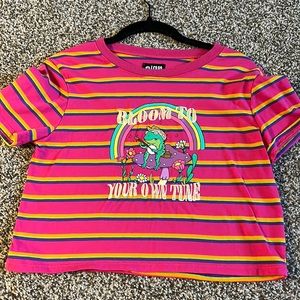 Size Small baby T. “Bloom to your own tune”.